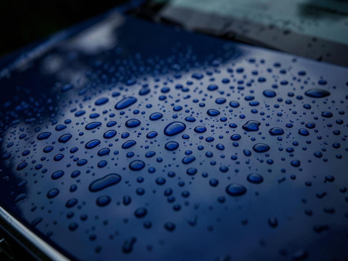 Water beading tightly on a ceramic coated car hood